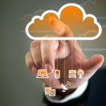 person tapping on orange cloud with different tech icons dangling from the cloud